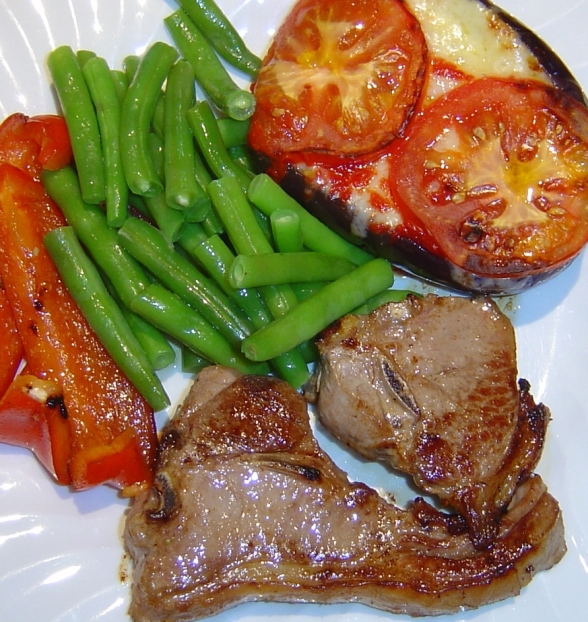 Pork chops and vegetables on a plate